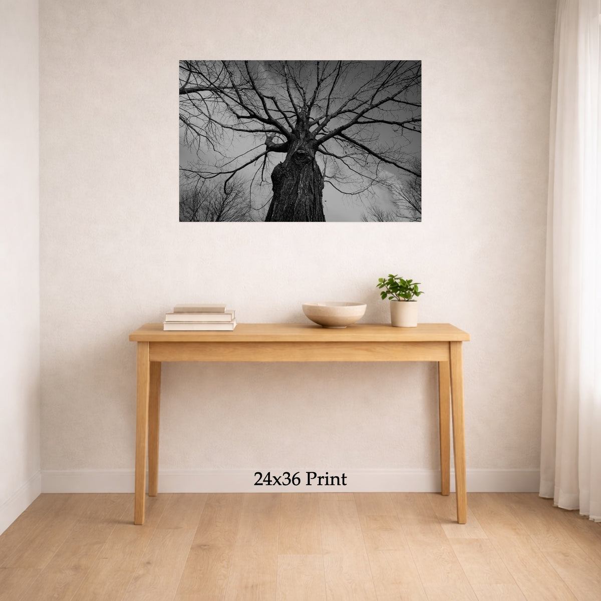 Towering Tree No. 1 as a 24x36 print on a wall above a console table, shown to scale