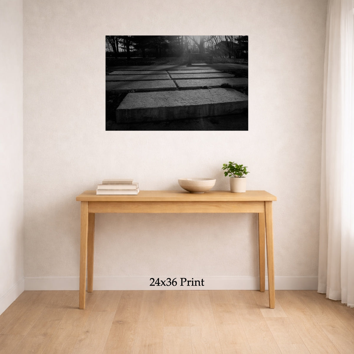 Groundwork as a 24x36 print on a wall above a console table, shown to scale